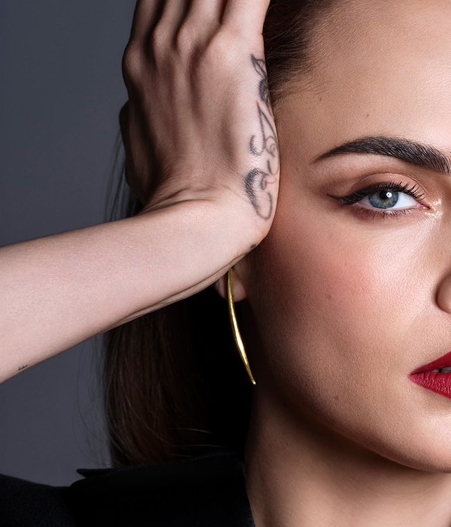 Close up of Cara Delevingne's face.