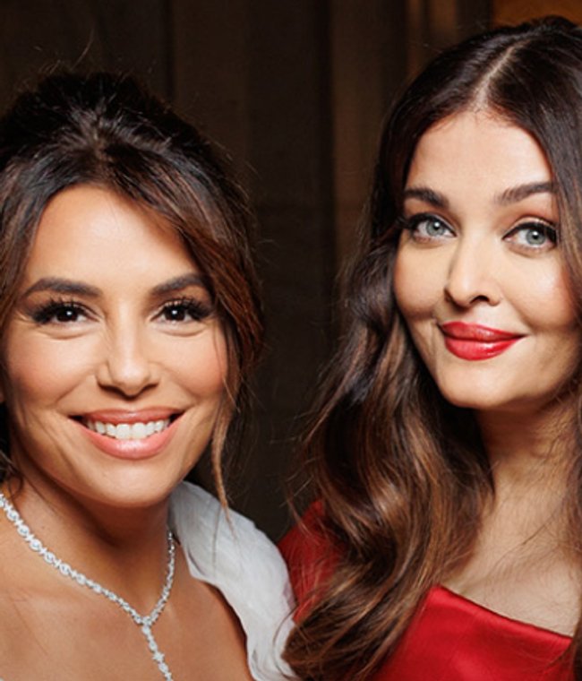 Eva Longoria, Aishwarya Rai and Aja Naomi King smiling backstage at Le Défilé 2024.