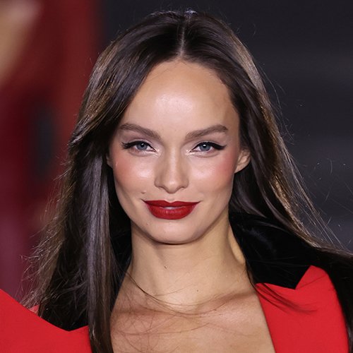 Luma Grothe wearing the dramatic Read the Rouge look with precise brows, winged eyeliner and cherry red lipstick.