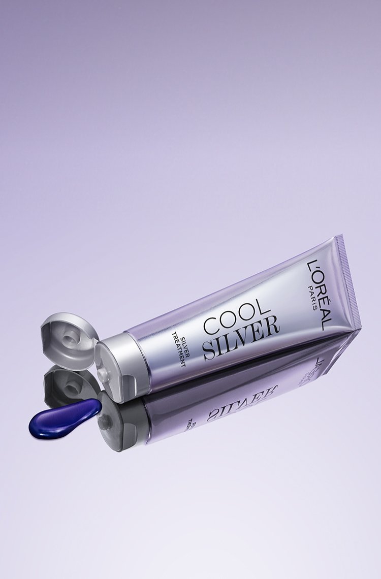 Cool Silver hair toner for grey hair - purple dyes and product tube reflecting on a brilliantly cool purple gradient