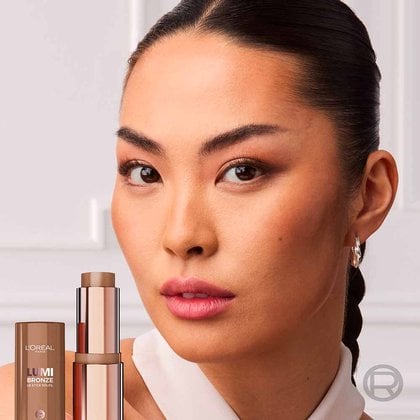 Model wearing Lumi Bronze Stick in shade 110 toasted sunlight for a natural bronzed makeup look